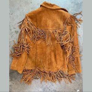 Custom made suede fringe jacket. Size S but runs a bigger. Never worn.